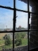 Widok na kościół przez okno wiatraka w Łąkorzu